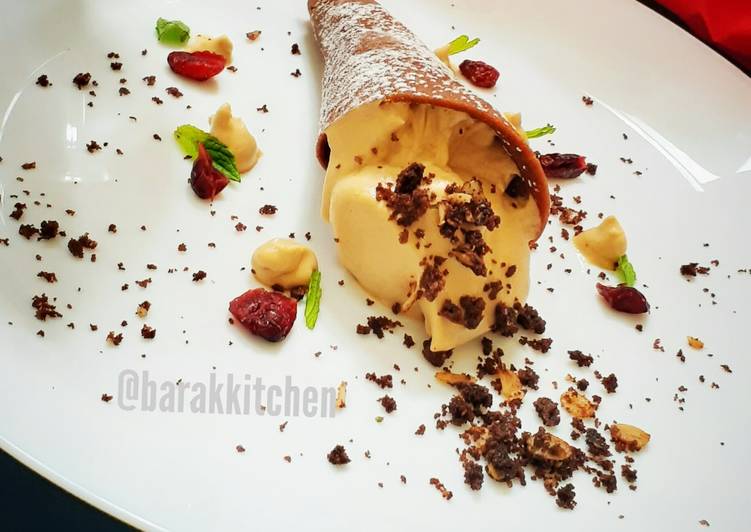 Cappuccino Mousse served with Chocolate cone and cookie crumbs