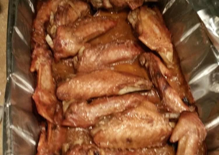 Deep fried Turkey wings smothered an covered in roasted garlic gravey.